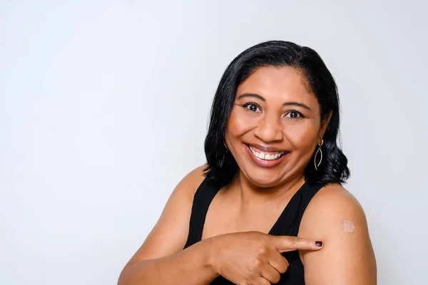 Woman Smiles Happily Shows Sticker Showing She Has Been Vaccinated — Fotografia de Stock