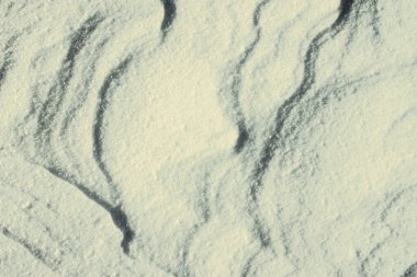 Kar şekilleri. Karda dalgalar. Kış manzarası. Kış arkaplanı