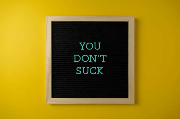 You Don Suck Sign Yellow Background — Zdjęcie stockowe