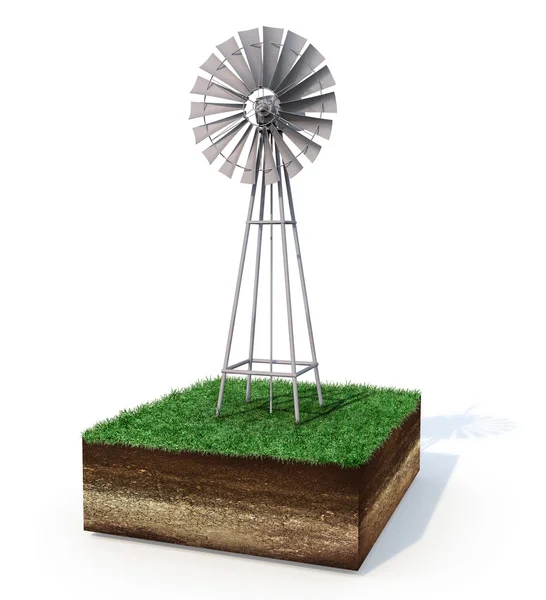 Metallic windmill on an isolated grassy land — Stock Photo, Image