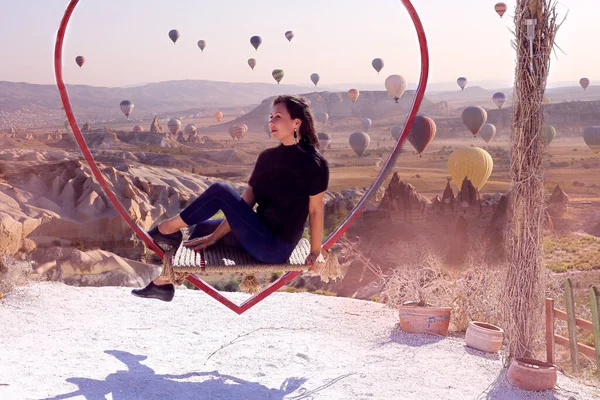 Woman Swing Shape Heart Backdrop Many Flying Balloons Cappadocia — Stock Photo, Image