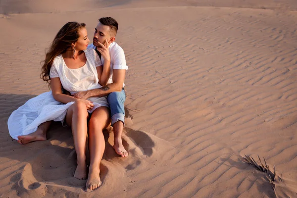 Girl Long Hairi White Dress Sits Sand Hugging Her Beloved Royalty Free Stock Images