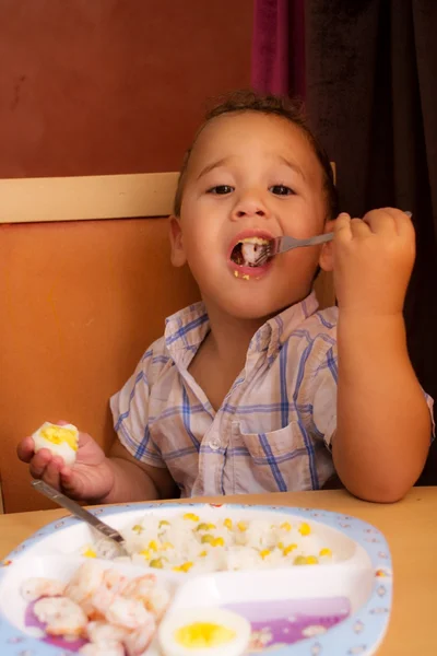 Kid eats. — Stock Photo, Image
