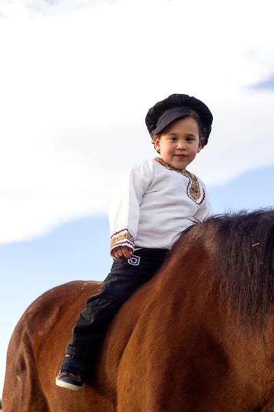 Child with a horse. — Stock Photo, Image