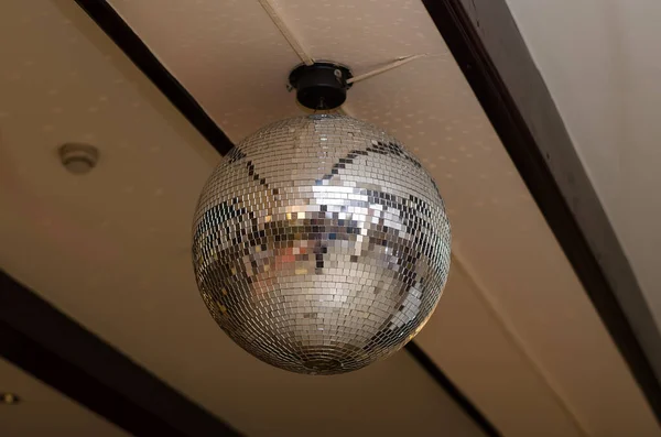 Mirrored disco ball on the ceiling in a restaurant