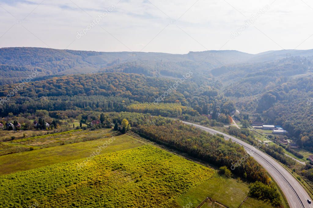 Drone photo of the main road leading out of City Zalaegerszeg to West on a foggy autumn morning, Hungary