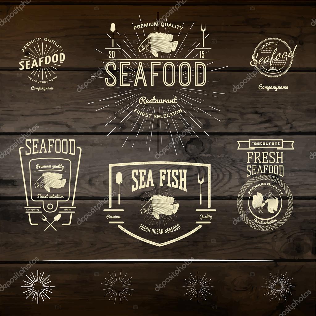Seafood badges logos and labels for any use. On wooden background texture