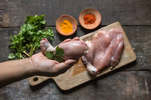 Close up a female hand holding chicken meat with use of selective focus