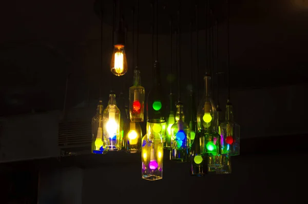 coloured lights inside the wine bottle hanging