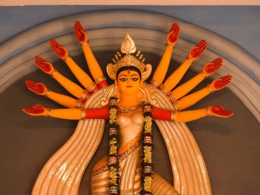 The Supreme shakti, Maa Durga is worshiped with diya lamp in utmost devotion in Hindu religion clipart