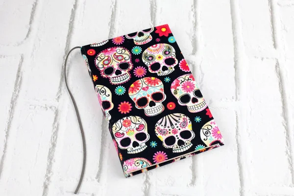 Handmade notebook with skulls fabric cover