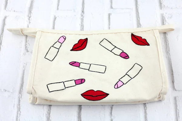 Makeup bag embroidery with white background