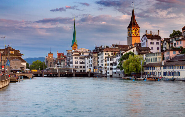 View of the facades of old medieval houses on the city promenade at dawn. Zurich. Switzerland.