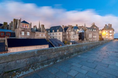 Saint-Malo. Old stone fortress wall at sunrise.