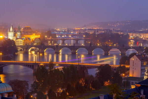 View of Prague and the Vltava River at night.