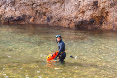 Tossa de Mar. Diver Cala Bona Bay.