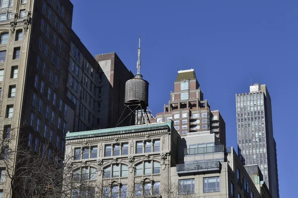 Water tower on top of a building — Stock Photo, Image