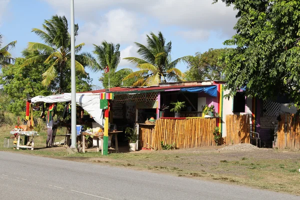 Typical colorful roadside fruit and craft stand or market in Antigua Barbuda Lesser Antilles, West Indies, Caribbean. — Stock Photo, Image