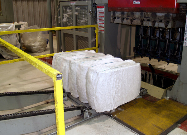 Completed cotton bale being pushed from a Cotton bale press in south Georgia.