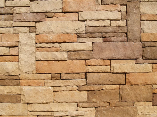 Multi-colored, sized and layered exterior stone wall. — Stock Photo, Image