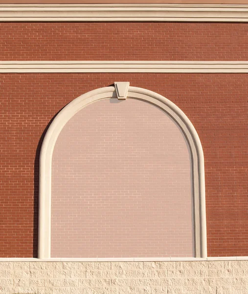 Ornate Roman styled brick wall with curved molding and a reduced opacity brick copy space. — Stock Photo, Image