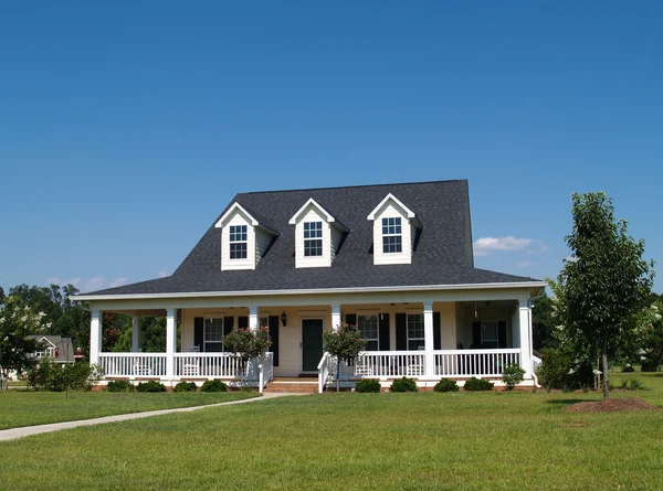 Two story residential home with vinyl or board siding on the facade. — Stock Photo, Image