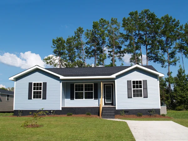 Powder blue low-income single-story home with porch. — Stock Photo, Image