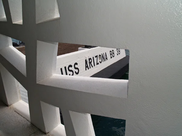 The USS Arizona Memorial sign as seen looking through a unique window at Pearl Harbor in Honolulu, Hawaii. — Stock Photo, Image