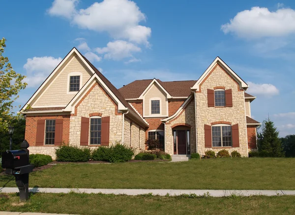 Large two story stone residential home with copy space, — Stock Photo, Image