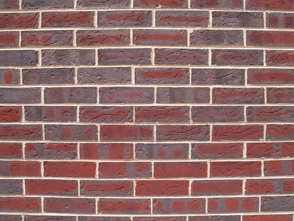 Vista de perto da parede exterior de tijolo vermelho e cinza . — Fotografia de Stock