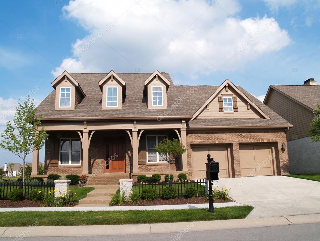 download-small-two-story-brick-home-with-porch-and-a-garage-in-front