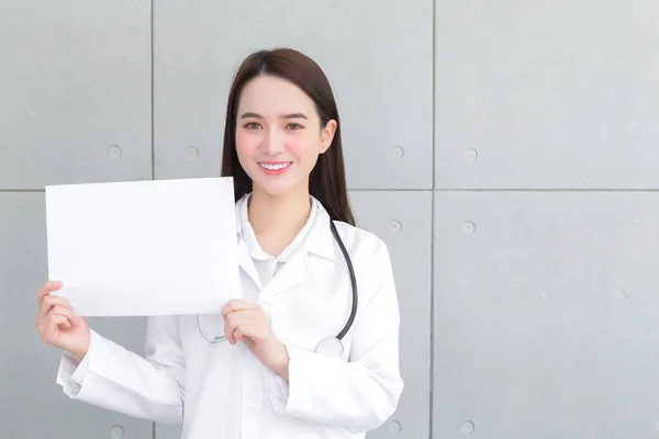 Asian Woman Doctor Who Wears Medical Coat Holds Shows White — Stock Photo, Image