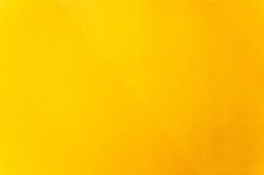Arka plan olarak çimento duvar dokusundaki altın veya sarı boya