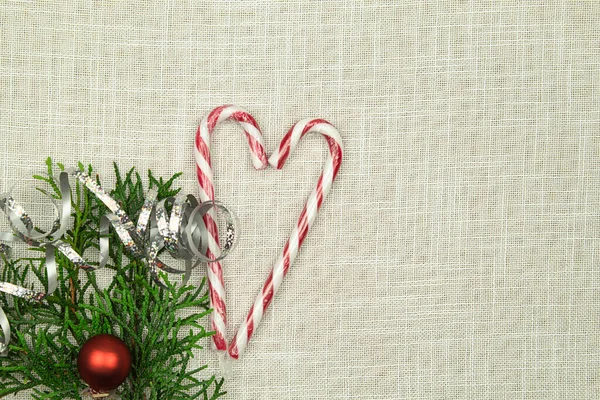 Cedar Branch Candy Canes White Fabric Background Place Text Christmas — Stock Photo, Image