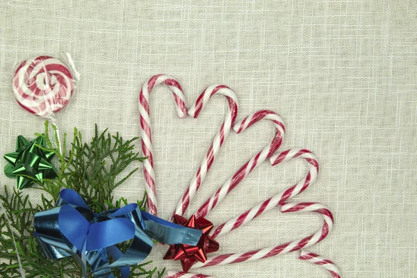Cedar Branch Candy Canes White Fabric Background Place Text Christmas — Stock Photo, Image