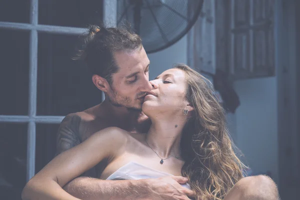 Couple making love in bed — Stock Photo, Image