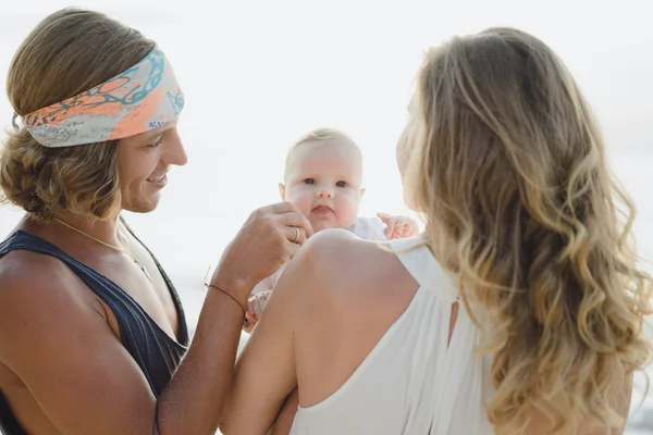 Beautiful young couple in love with a child — Stock Photo, Image