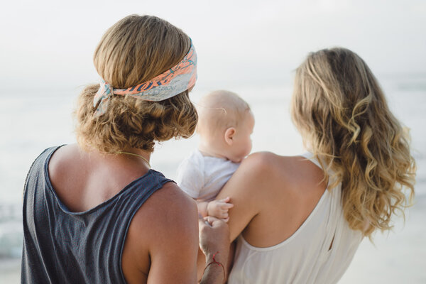 beautiful young couple in love with a child