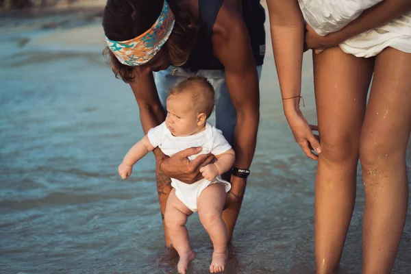 Beautiful young couple in love with a child — Stock Photo, Image