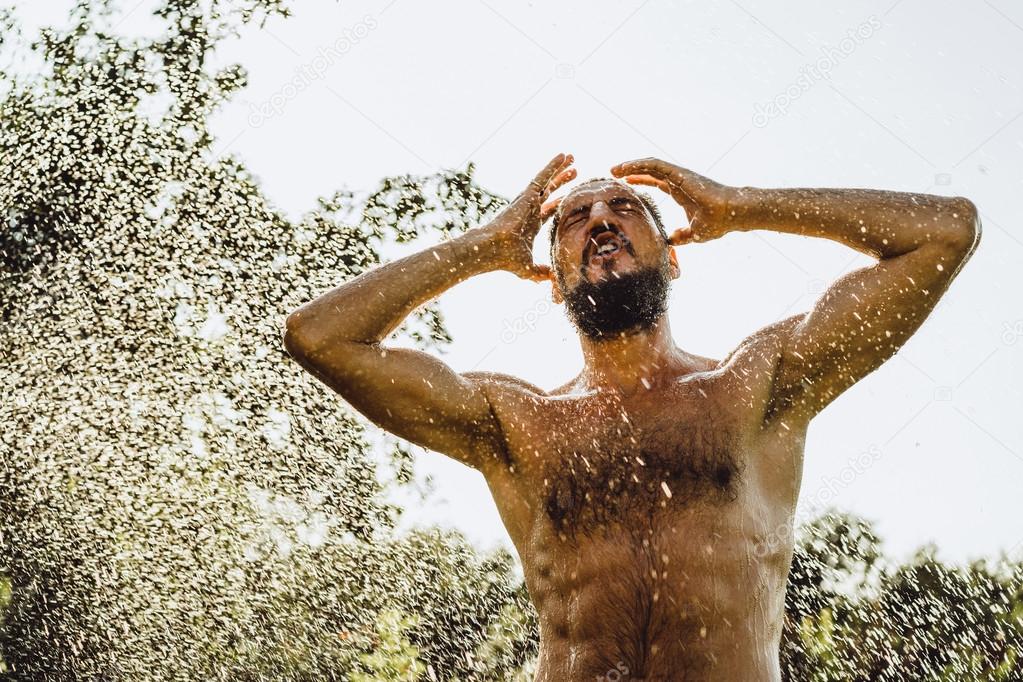bearded man in green summer nature