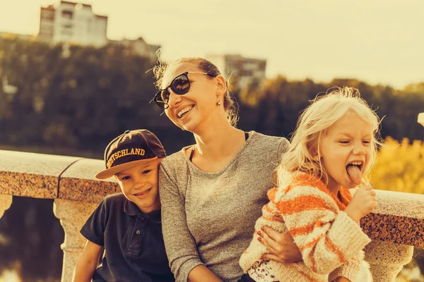 Mother with children at the park — Stock Photo, Image