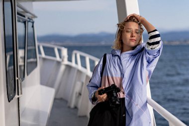 young woman professional photographer with camera