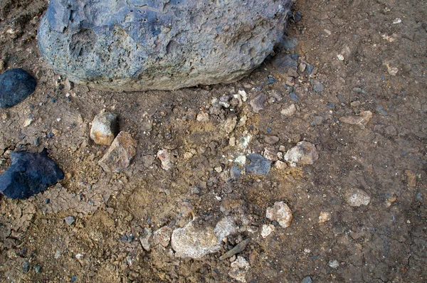 Pedras no vulcão com areia molhada — Fotografia de Stock