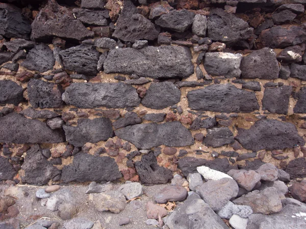 Vallende stenen in muur — Stockfoto