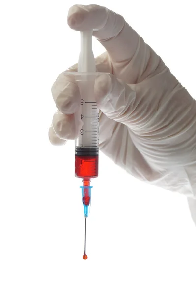 Hand with syringe isolated on white — Stock Photo, Image