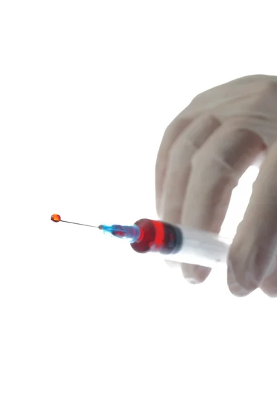 Hand with syringe isolated on white — Stock Photo, Image