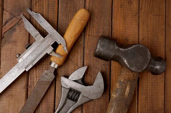 Hammer, caliper, file and wrench  Old tools — Stock Photo, Image