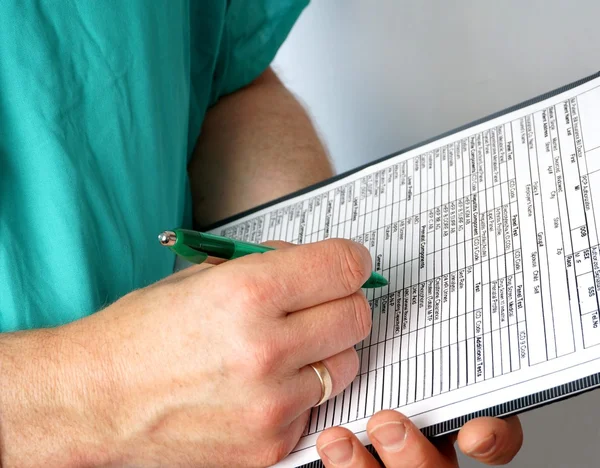 Doctor with medical chart — Stock Photo, Image