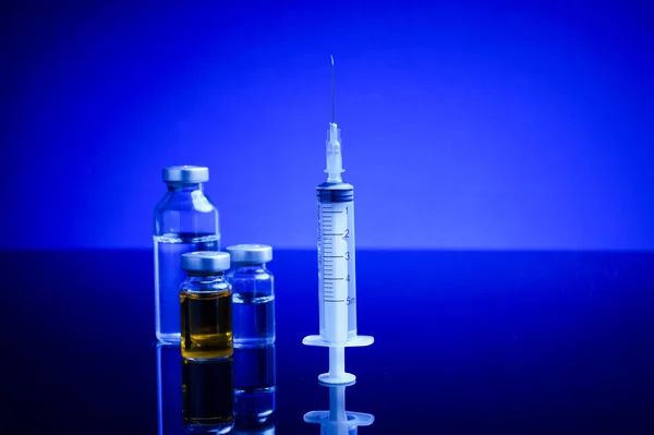 Syringe and medical vials — Stock Photo, Image