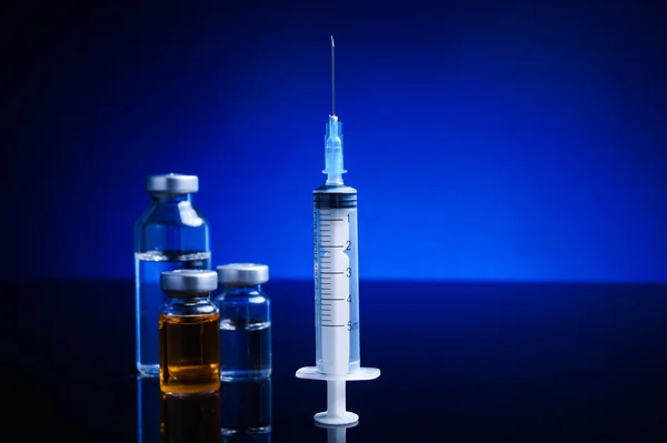 Syringe and medical vials — Stock Photo, Image